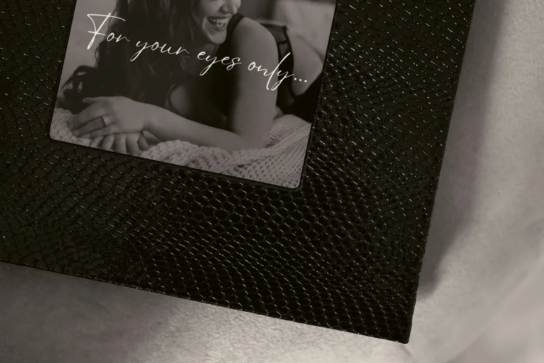 Black and white photo of the cover of a boudoir album