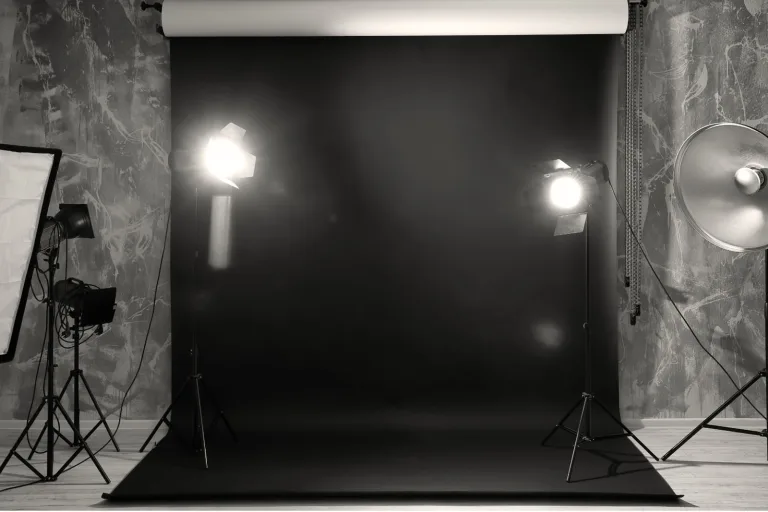 Black and white photograph of portrait studio backdrops and lighting
