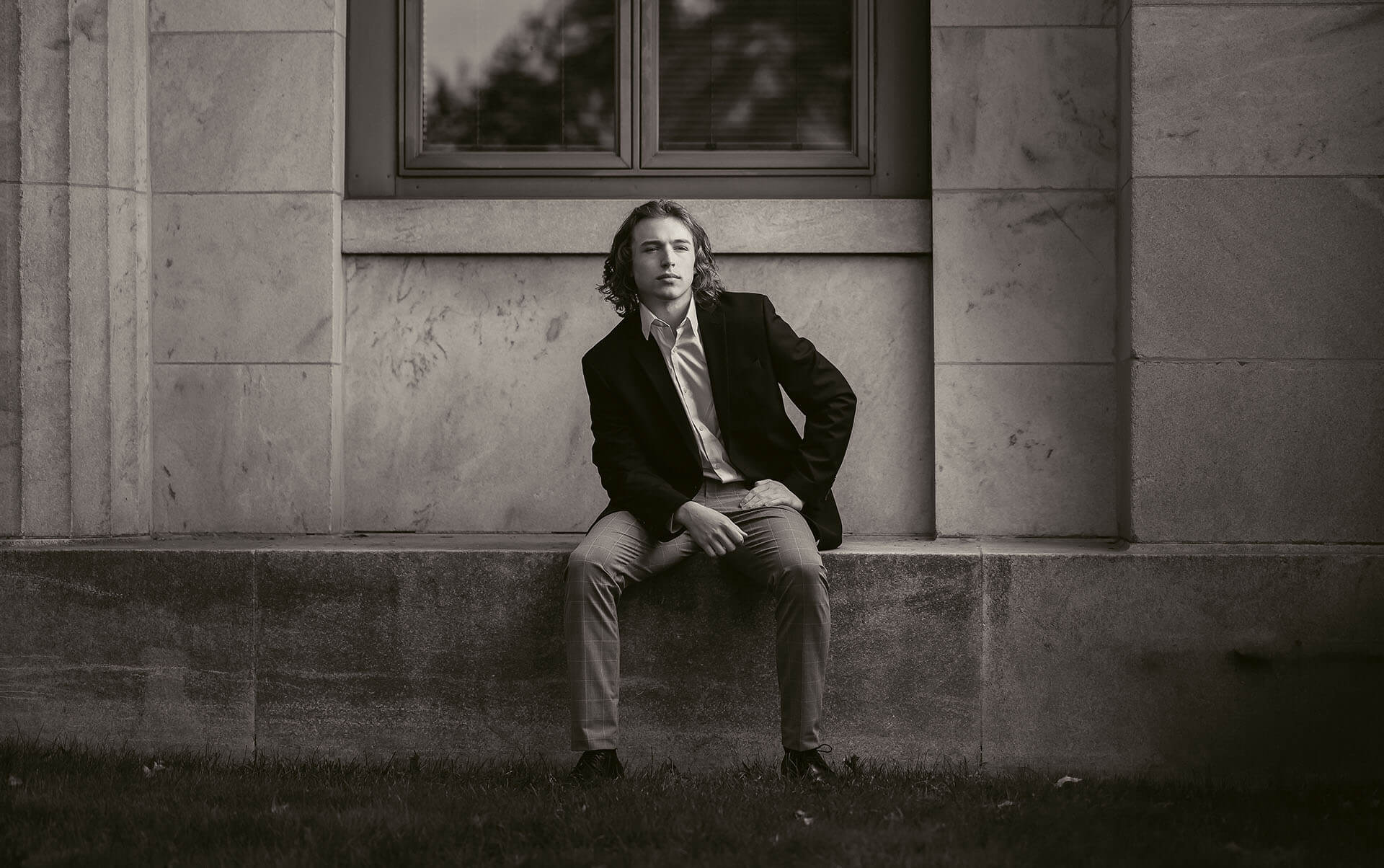 Black and white senior portrait of high school boy