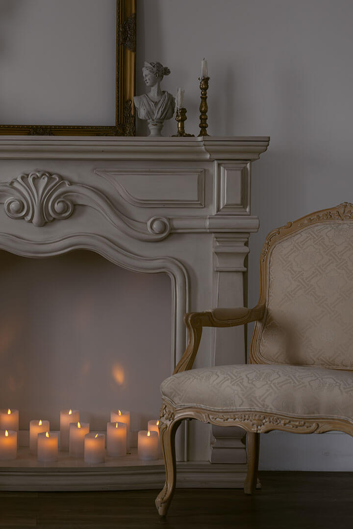 boudoir studio interior space with candles and fireplace mantle